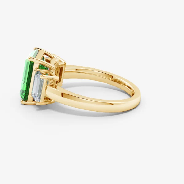 Side view of real emerald-cut three-stone ring
